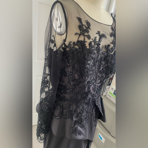 Terani Couture Embroidered Long Sleeve Front Slit Ruffled Mermaid Gown.